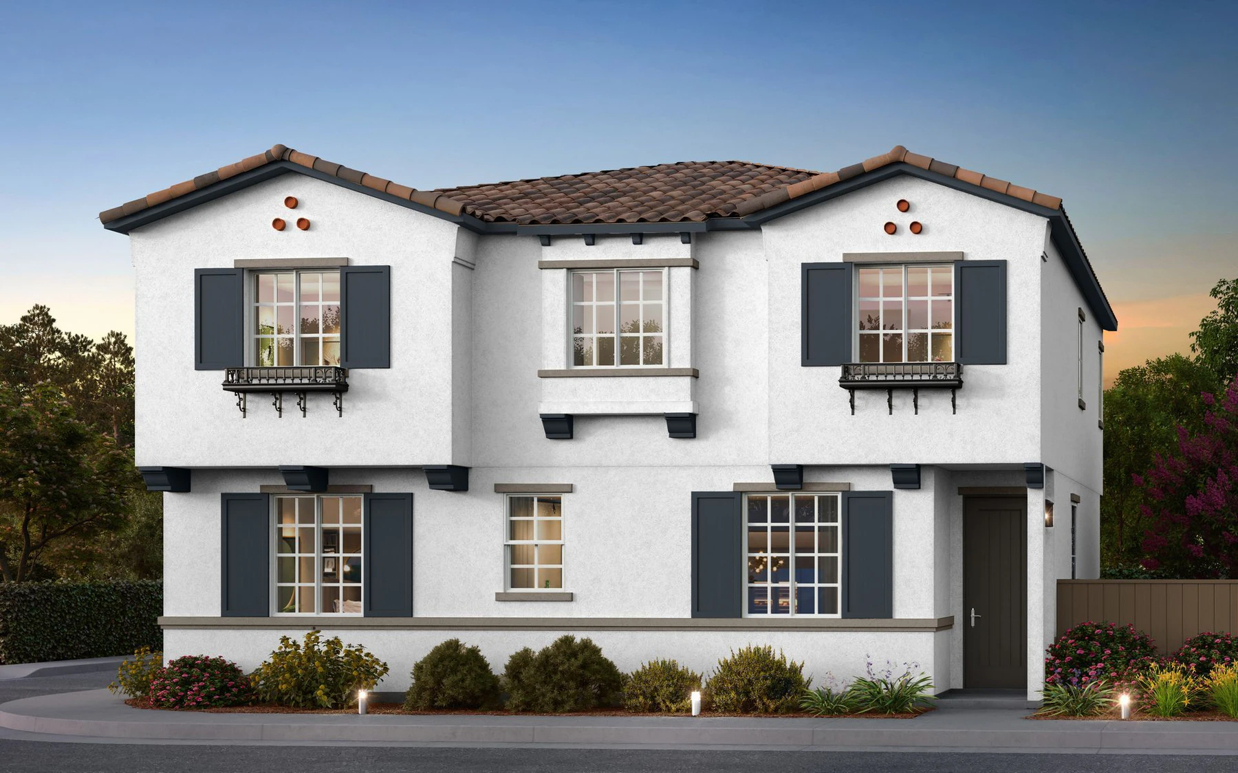 A two-story Las Palmas home by RC Hobbs at golden hour in Jurupa Valley