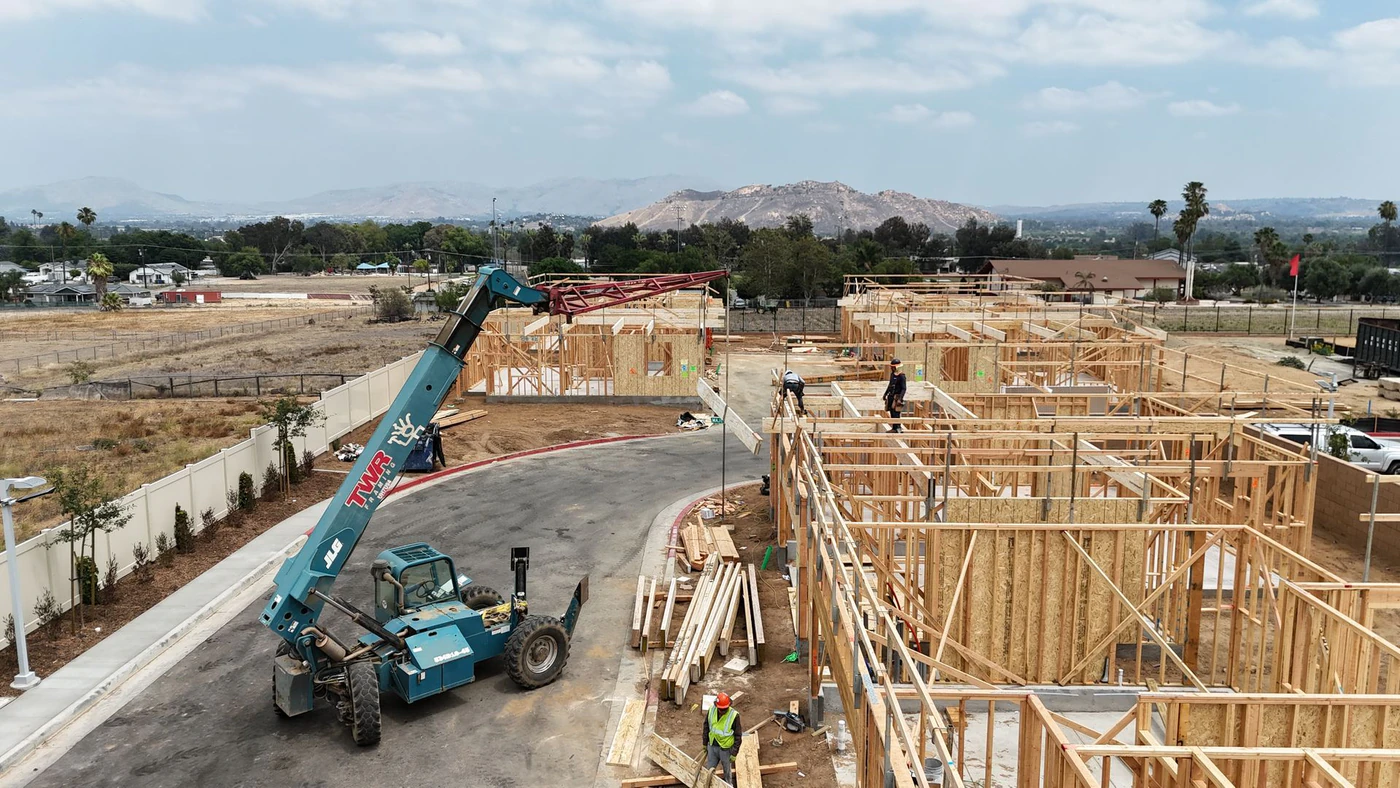 An RC Hobbs neighborhood mid-construction, two-story homes being framed