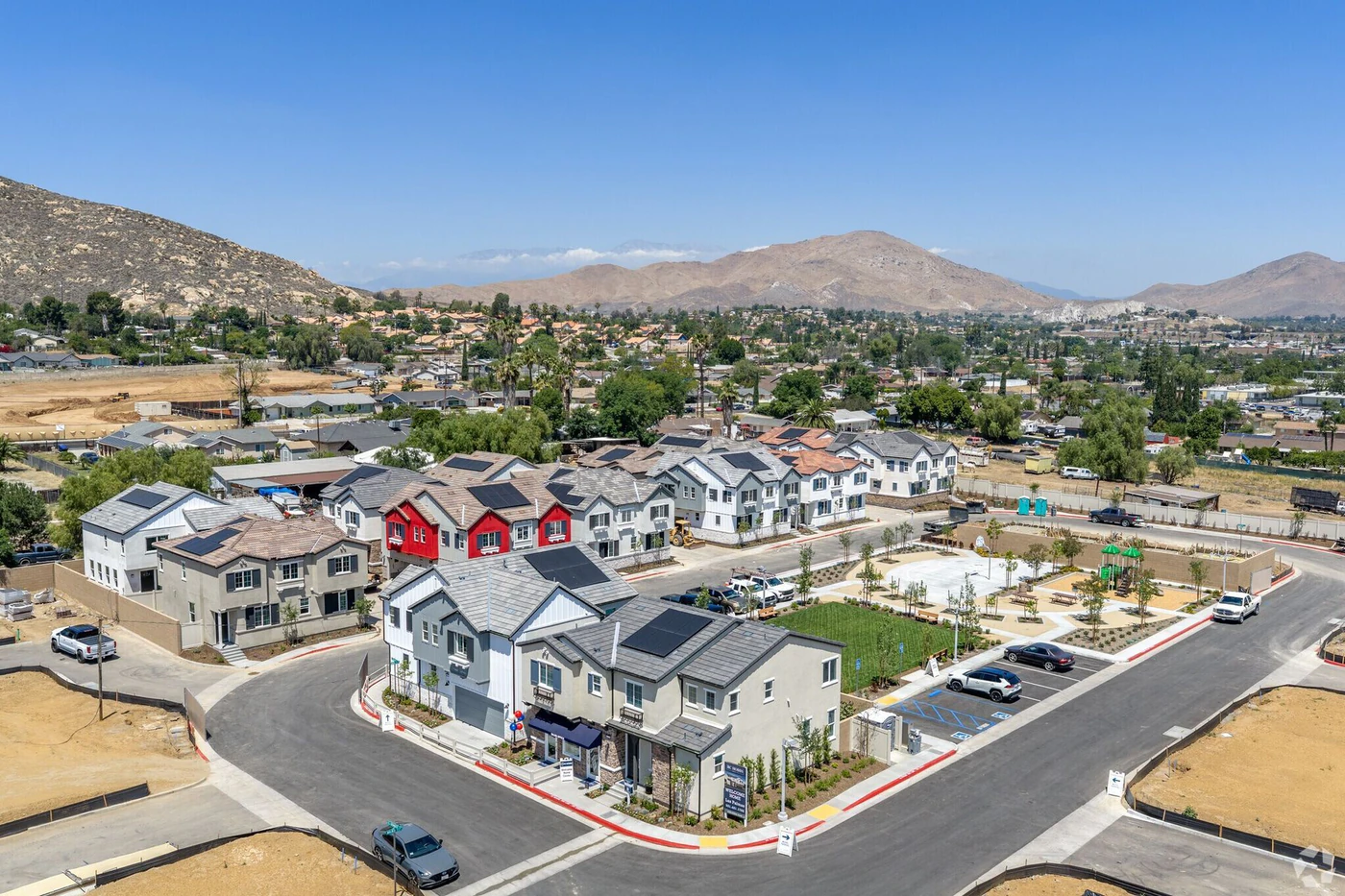 A finished RC Hobbs community of homes with mature landscaping and mountains beyond